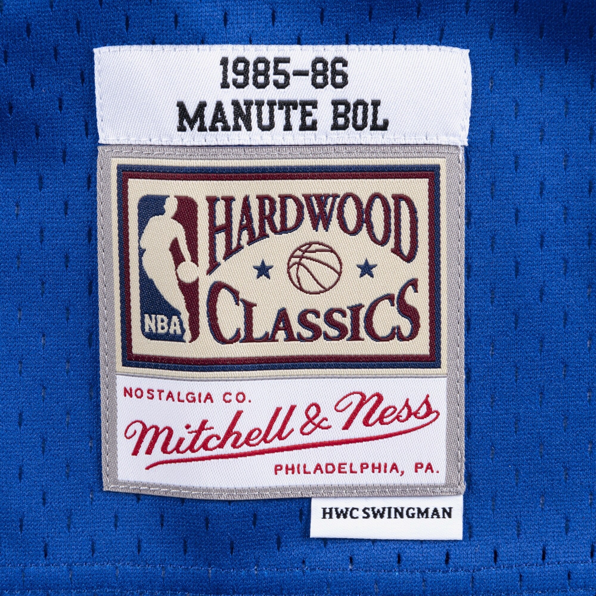 MENS MITCHELL & NESS NBA SWINGMAN JERSEY BULLETS 1985 MANUTE BOL